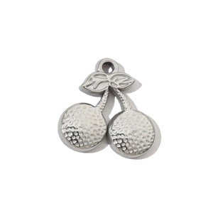 Macro view of silver cherry pendant with hammered texture for DIY jewelry making