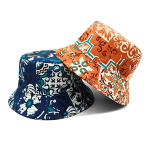 Reversible Bohemian sun hats featuring vintage patterns in blue and orange tie-dye colors