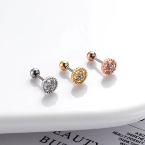Detailed view of screw-back tragus earrings in silver, gold, and rose gold with zircons