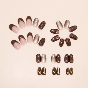 Detail of brown cat-eye press-on nails with leopard print and sparkling rhinestones