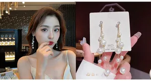 Detailed macro view of S925 silver long tassel earrings with elegant white pearls