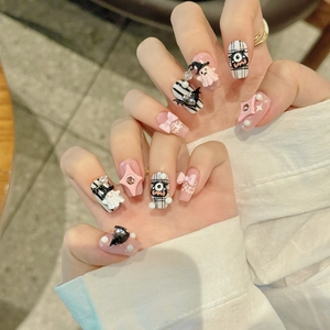 Handmade Halloween monster press-on nails with 3D ghost and pink bow designs