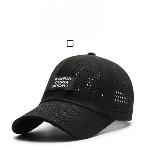 Detail of breathable laser-cut mesh and rubber sport patch on black quick-dry baseball cap