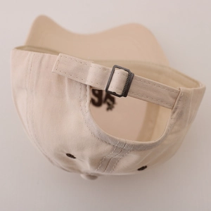 Adjustable beige cotton baseball cap back view with metal buckle and embroidery vents