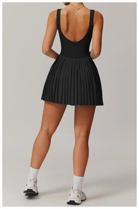Back view of a black backless tennis dress featuring a pleated skirt and U-neckline design
