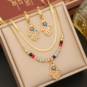 Golden Hamsa jewelry set with snake chain necklace, beaded bracelet and hand earrings