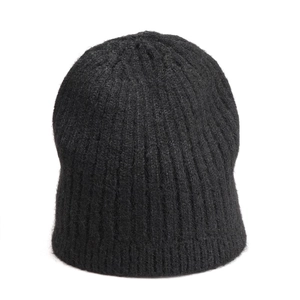 Close-up of black wool blend beanie featuring thick ribbed knit texture and warmth