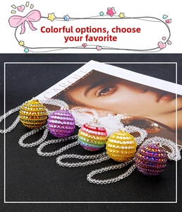 Detailed view of colorful sparkling rhinestone ball car ornaments in five vibrant styles