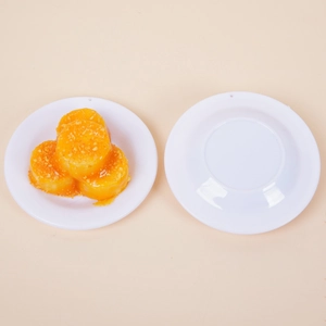 Realistic 9cm artificial corn cake food model displayed on a white plate on a tan background