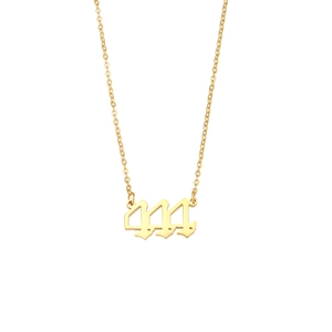 Macro detail of gold-plated stainless steel necklace with 444 gothic number pendant