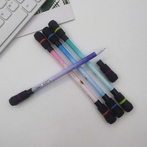 Detail showing colorful spinning pens in purple pink and blue with weighted ends