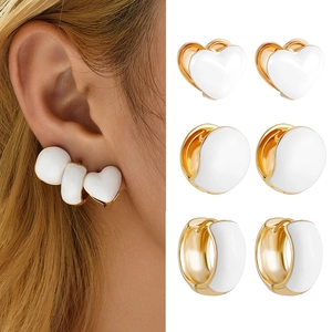 Three-pair gold and white enamel earring set featuring heart, round, and C-shaped designs