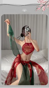 Macro detail of red silk backless top with gold embroidery and green sheer scarf