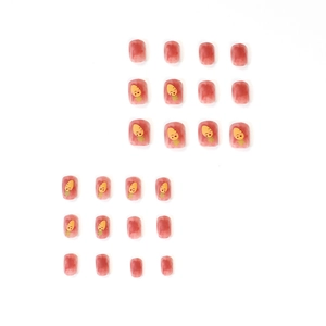 Cute orange gradient press-on nails with cartoon carrot patterns and marble texture