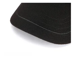 Detailed close-up of thick wool baseball cap brim with durable parallel stitching