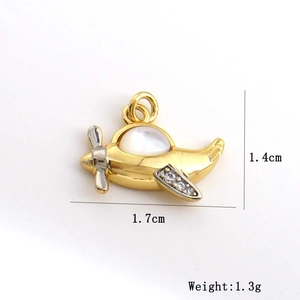 Macro view of gold airplane pendant with white zircon stones and size dimensions