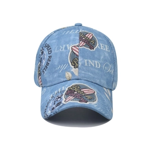 Vintage washed blue denim baseball cap featuring retro Speed Rebels graphic prints
