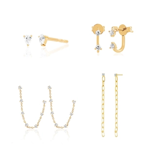 Detailed showcase of four gold tassel and zircon earrings with elegant drop designs