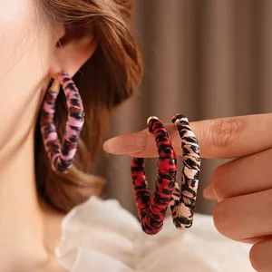 Vintage leopard print hoop earrings in pink red and brown with golden metal studs