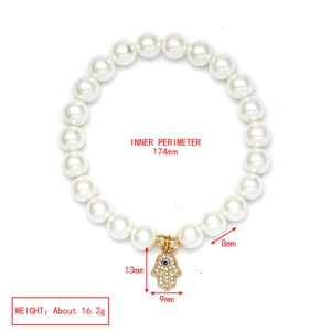 Detail view of 8mm pearl bracelet with Hamsa Hand pendant and size measurements