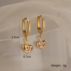 Detail of gold heart hoop earrings with pink gemstones and dimensions marking