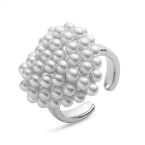 Macro detail of silver adjustable ring with cluster of white round pearls on top