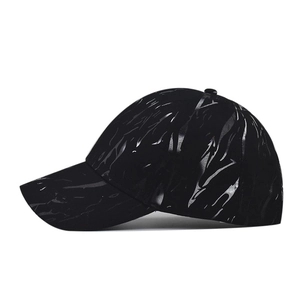 Black tie-dye baseball cap with glossy abstract printed pattern and curved brim