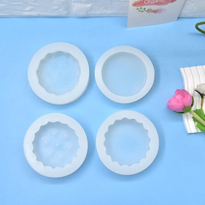 Set of 4 round silicone molds for DIY emoji cookies and mousse cakes with varied patterns
