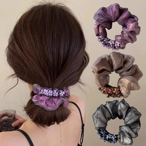 Mesh scrunchies with pearls and flowers in purple, bronze, and grey colors