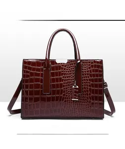 Front view of a dark red crocodile pattern tote bag with polished finish and silver hardware