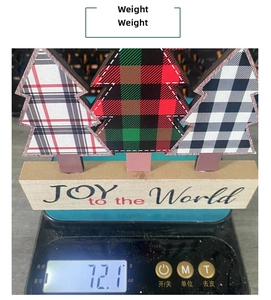 Detailed weight measurement of plaid wooden Christmas trees on a digital scale