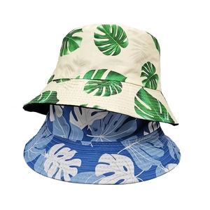 Double-sided reversible bucket hat with tropical monstera leaf print for sun protection