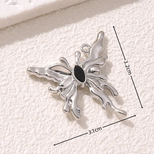 Silver liquid metal butterfly pendant with black stone inlay, size 3.2cm by 3.1cm
