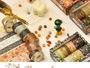 Detailed close-up of floral washi tape set in a vintage aesthetic stationery arrangement