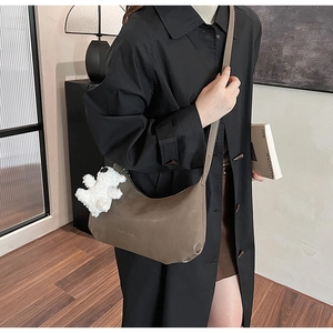 Fashionable PU leather shoulder bag in dark khaki with a cute plush bear pendant accessory