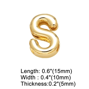 Close-up of polished gold 15mm letter S heart charm for DIY bracelet and watch band