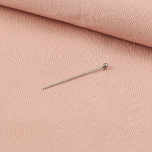 Detail of a 0.6mm silver stainless steel ball head pin for DIY jewelry making