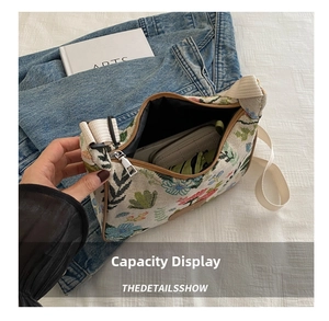 Interior view showing the large capacity of a floral canvas bag with a zipper