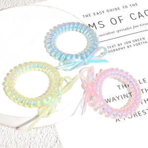 Lot de 3 élastiques spirale irisés avec nœuds aux couleurs bleu vert et rose bonbon