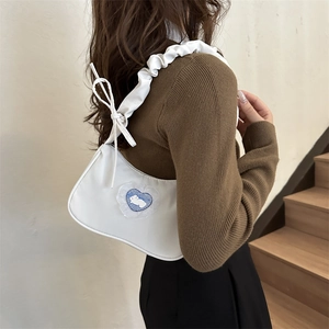 White minimalist underarm bag with pleated strap and heart rabbit patch for women