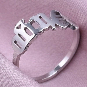 Macro shot of silver personalized gothic letter Julia ring with adjustable band