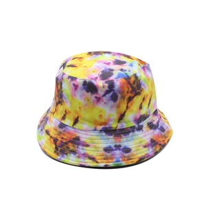 Close-up of colorful tie-dye cotton bucket hat featuring reinforced stitching on the brim