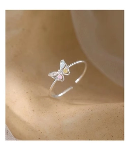 Detailed macro view of a 925 silver butterfly ring with colorful cubic zirconia stones