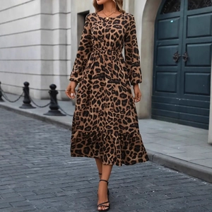 Close-up of leopard print maxi dress with elegant lantern sleeves and ruffled hemline