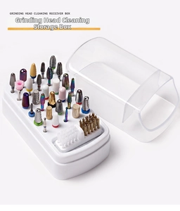 Close-up of a 30-hole nail drill bit storage box with brushes and a clear protective cover