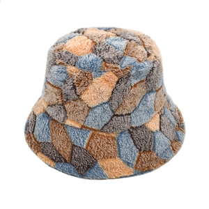 Winter plush bucket hat with colorful patchwork design in blue, orange, and grey colors