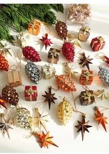 Close-up of Nordic electroplated Christmas tree ornaments in festive metallic tones