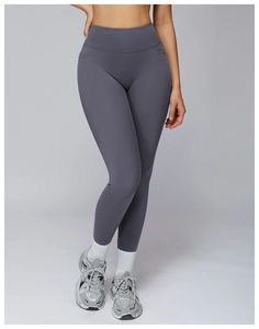 Close-up of high-waisted yoga pants featuring functional side pockets and matte finish