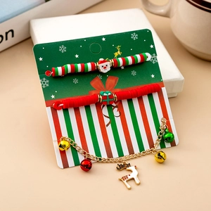 Detailed set of Christmas bracelets with Santa and reindeer charms on festive card