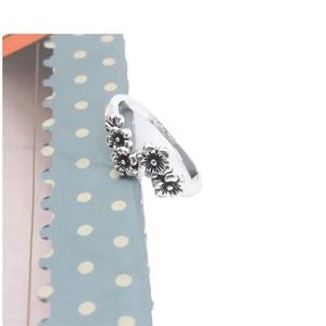 Vintage silver cherry blossom ring with multiple 5-petal flowers and blackened details